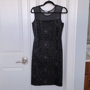 Black dress with silver details, mesh top. Olivia Matthews small S
